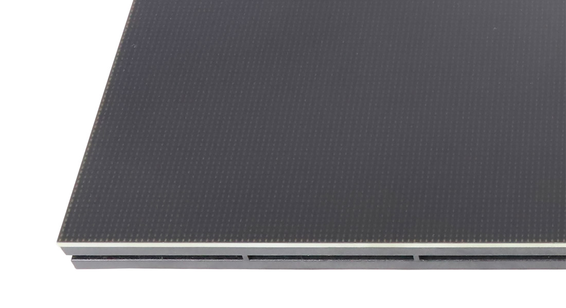 Close view of an EagerLED COB module's smooth encapsulated surface and edge